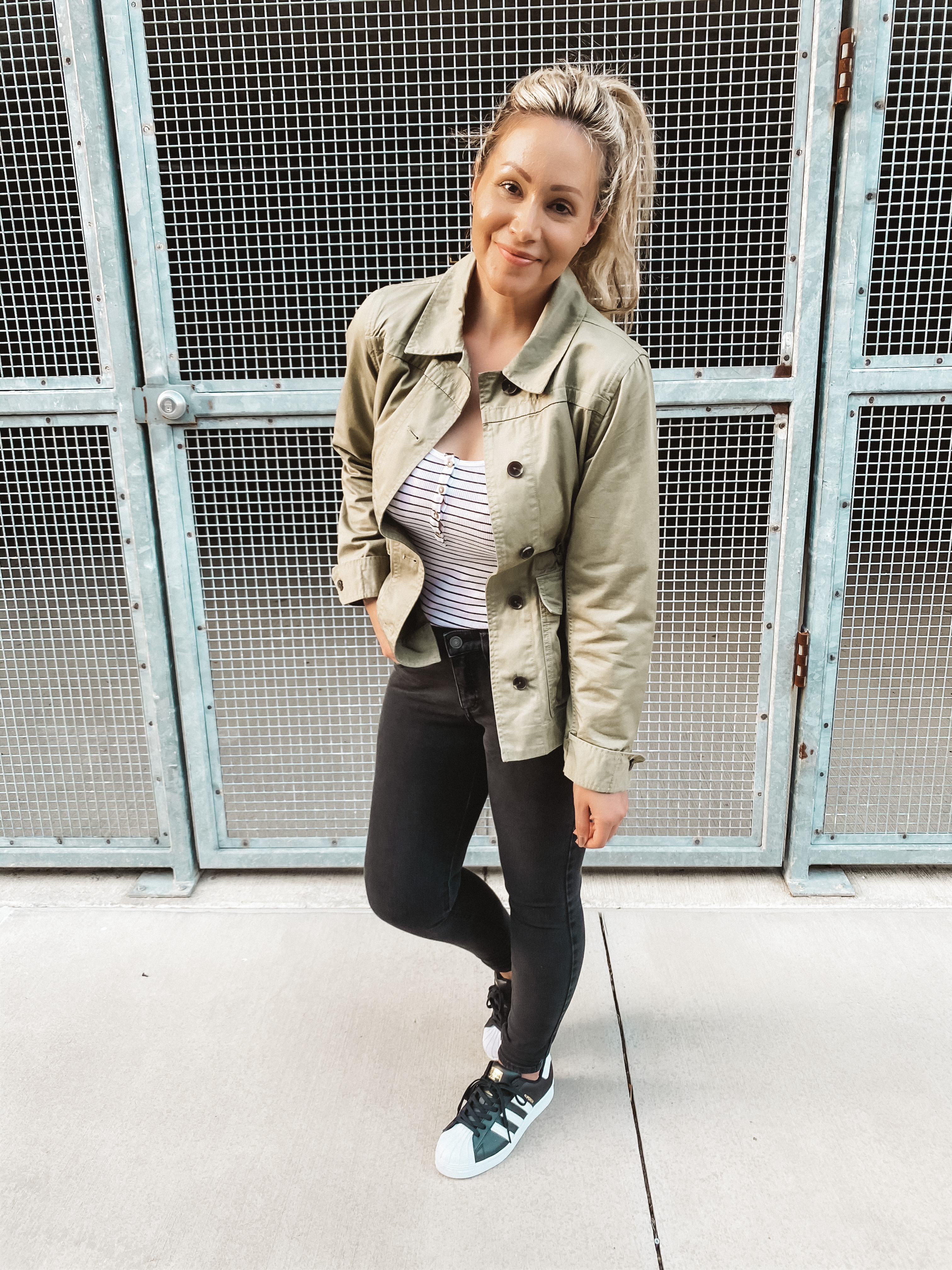 Casual wear fashion blogger wearing a green utility jacket.